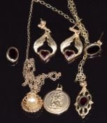 Two 9ct gold necklaces, 9ct gold St Christopher and a pair of earrings set with garnets, 7.7g