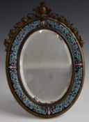 19thC champlevé enamel bevelled glass easel back bronze mirror with scrolling garland finial,