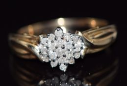 A 9ct gold ring set with diamonds in a cluster, total diamond weight approximately 0.25ct, 3.6g,