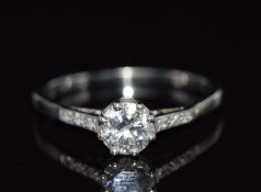 An 18ct white gold ring set with a round cut diamond of approximately 0.6ct, 2.7g, size O