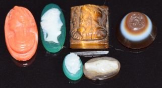 Cameos including tiger's eye, coral and agate and a banded agate intaglio, largest 1.5 x 0.8cm