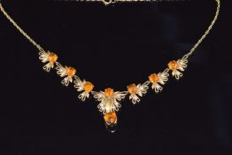 A 9ct gold necklace set with citrines and pearls in a stylised foliate design, 16.5g