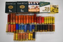 A collection of 28, 12 bore and .410 shotgun cartridges together with various primed empty cases,