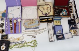 A collection of costume jewellery necklaces including silver, pearl, peridot, silver earrings etc