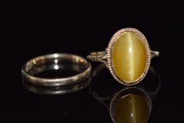 A 9ct gold ring set with chrysoberyl (2.6g, size P) and a 9ct gold ring, 1.9g, size L