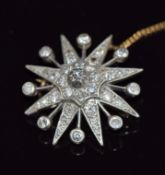 A c1900 star brooch set with diamonds in gold and white metal setting, 6.2g, 2.8cm