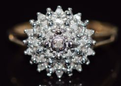 A 9ct gold ring set with diamonds in a cluster, total diamond weight approximately 0.1ct, 1.9g, size