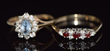 Two 9ct gold rings, one set with garnets the other topaz, 3.1g, sizes N and M