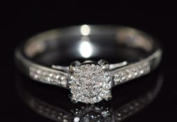 A 9ct white gold ring set with diamonds, 1.9g, size K