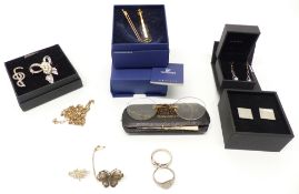 A collection of jewellery including silver rings, silver filigree brooches, Swarovski model, etc