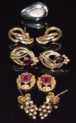 Three pairs of 9ct gold earrings, two sections of earrings set with a ruby to each (5.3g), and an