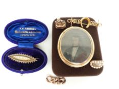 A 15ct gold brooch set with pearls, Victorian locket set with daguerreotype, 9ct gold horseshoe