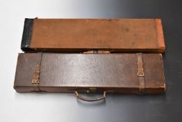 Two vintage canvas and leather bound gun cases, both with fitted interiors, largest 83x21x8cm.