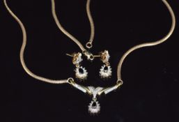 A 9ct gold necklace set with black diamonds and diamonds with matching earrings, 7.3g