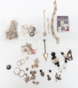 A collection of silver including earrings, bracelet, St Christopher charms, etc