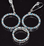 A 14k gold pendant set with blue diamonds and diamonds, with matching earrings, 4.6g