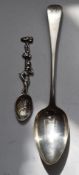 Arts & Crafts hallmarked silver teaspoon the handle formed as man with foliage beyond, London