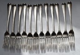 Set of twelve Georgian hallmarked silver table forks, with bright cut decoration, London 1786, maker
