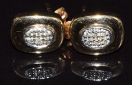 A pair of 9ct gold earrings set with diamonds, 2.1g