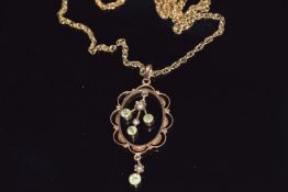 Edwardian 9ct gold pendant set with peridot and seed pearls on 9ct gold chain, 5.7g