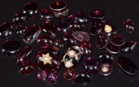 A collection of garnet cabochons, some set with seed pearls 17.7g