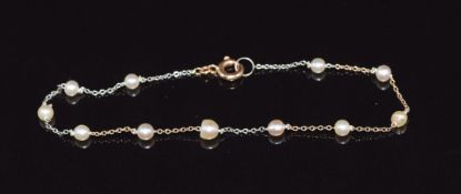 A 9ct gold bi-coloured bracelet set with pearls