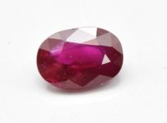 A loose 0.6ct oval cut natural ruby, with certificate indicating no heat treatment