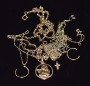 A 9ct gold cherub pendant  and sections of 9ct gold chain/ necklace, 6.3g