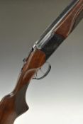 Baikal NX-27 12 bore over and under shotgun with engraved scenes of birds to the lock, engraved