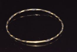 An elephant hair and yellow metal bangle