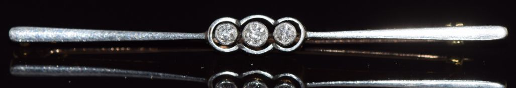 A c1930 9ct gold brooch with a platinum finish set with three diamonds, in original box, 4g, 6.2cm