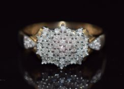 A 9ct gold ring set with diamonds in a cluster, total diamond weight approximately 0.5ct, 3.1g, size