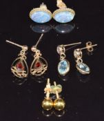 A pair of 9ct gold earrings set with an opal triplet to each, a pair of 18k gold studs, a pair of
