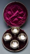 A 19thC cased set of four silver plated footed salts, diameter of case 19cm