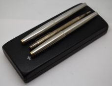 Two Parker 61 fountain pens with brushed stainless steel bodies and a hallmarked silver Yard-O-Led