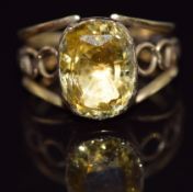 Georgian/ Victorian ring set with an oval cushion cut yellow sapphire of approximately 5ct in a
