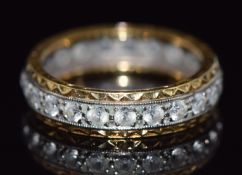 An 18ct gold eternity ring set with paste, 4.6g, size N/O