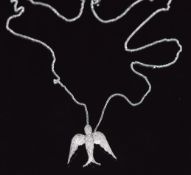 An 18ct white gold pendant in the form of a swallow, set with diamonds, 4g
