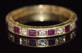 An 18ct gold half eternity ring set with rubies and diamond, 2.6g, size L/M