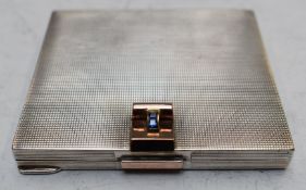 Art Deco hallmarked silver engine turned powder compact with gold detailing set with two square