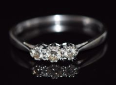 An 18ct white gold ring set with three diamonds, total diamond weight approximately 0.25ct, 2.6g,