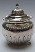 Edward VII hallmarked silver tea caddy with hinged lid raised on lion paw feet, Birmingham 1905,