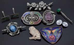 A silver brooch set with paste in a floral design, another silver brooch set with green agate