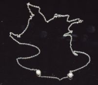 A 9ct white gold necklace set with two pearls, 3.3g