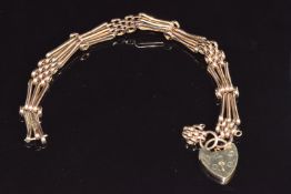 A 9ct rose gold gate bracelet with heart padlock, 10.9g