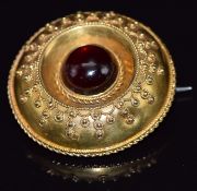 Victorian Etruscan Revival brooch set with a garnet cabochon, 3.2cm, 7.7g