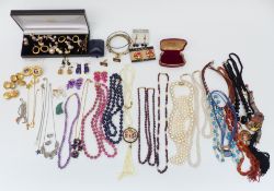 A collection of jewellery including silver earrings, silver pendant, necklaces including amethyst