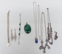 A silver pendant set with malachite, a silver necklace set with labradorite and amethysts, silver