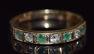 A 9ct gold half eternity ring set with round cut emeralds and diamonds, 1.5g, size I