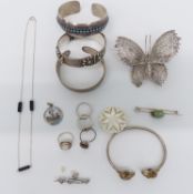 Silver jewellery including three bangles, filigree brooch and four rings, St George and the dragon